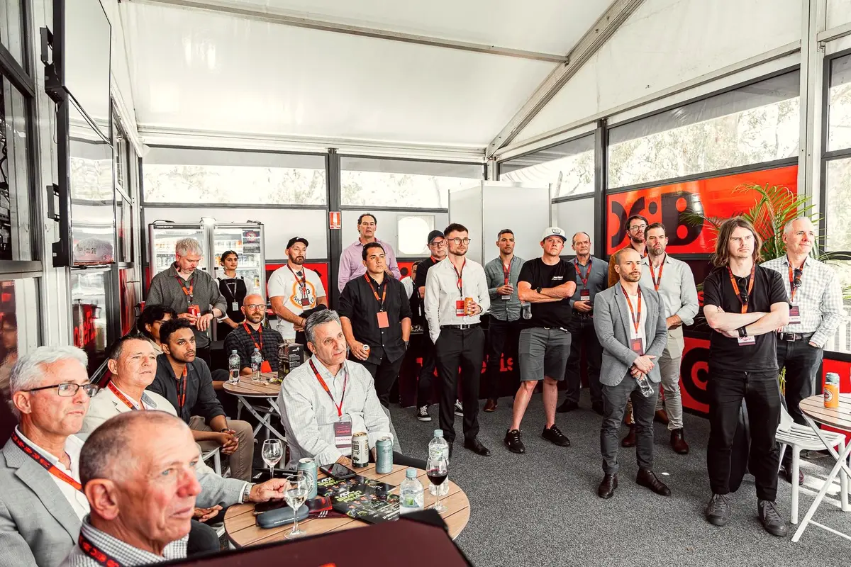 Guests in a CodeFish marquee listening to a presentation