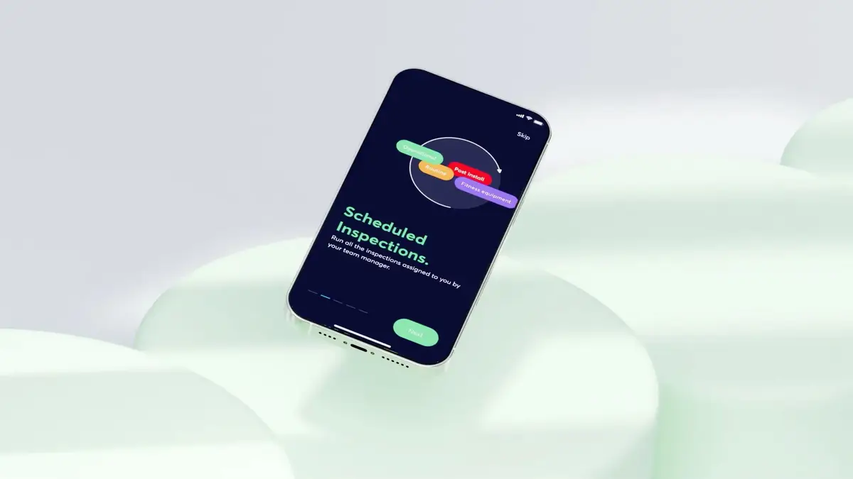 Smartphone showing a Scheduled Inspections onboarding screen on a pale green backdrop