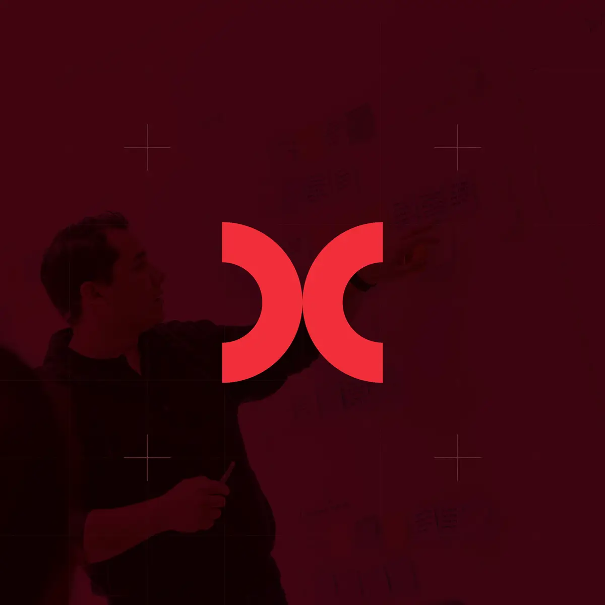 CodeFish brand mark over a red-tinted photo of someone pointing at sticky notes