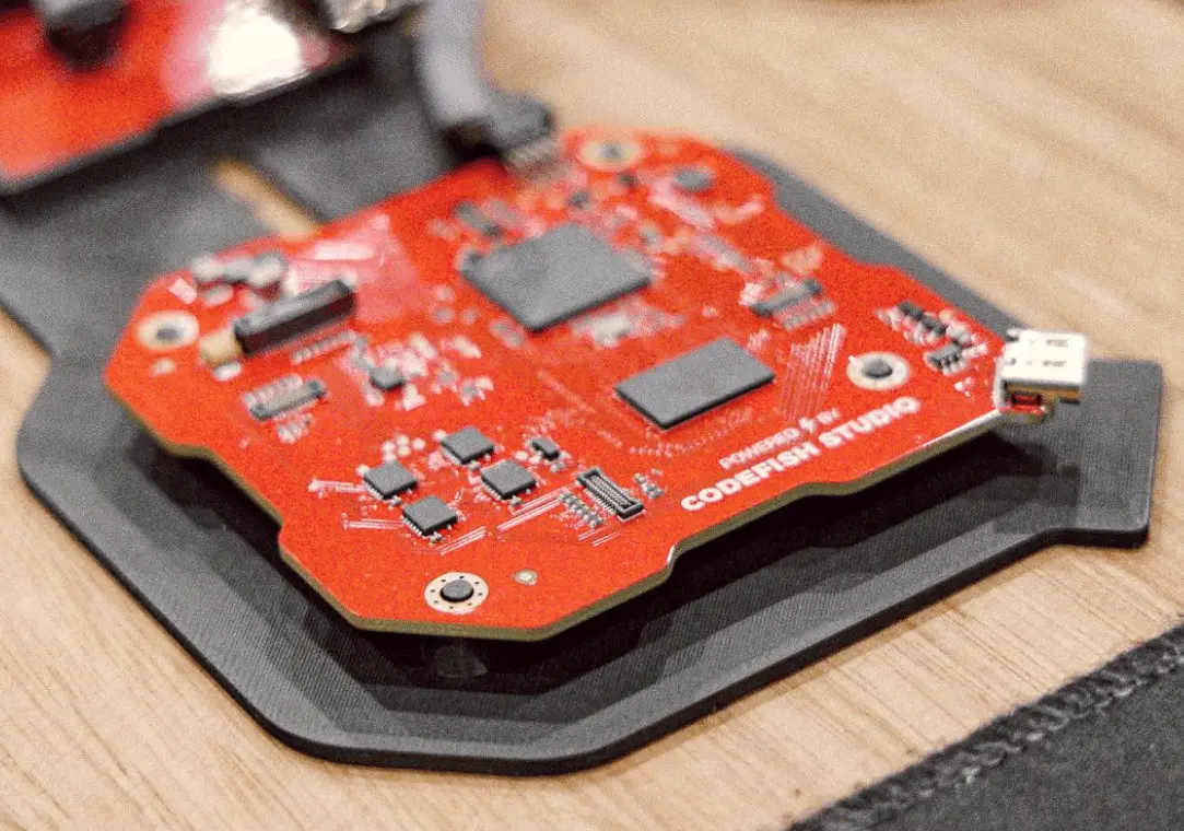 Red circuit board printed with Powered by CodeFish Studio