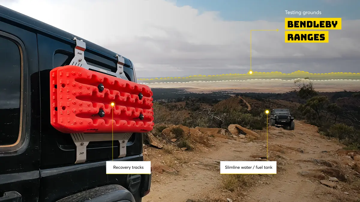 4WD with red recovery tracks on a dirt trail at the Bendleby Ranges testing grounds